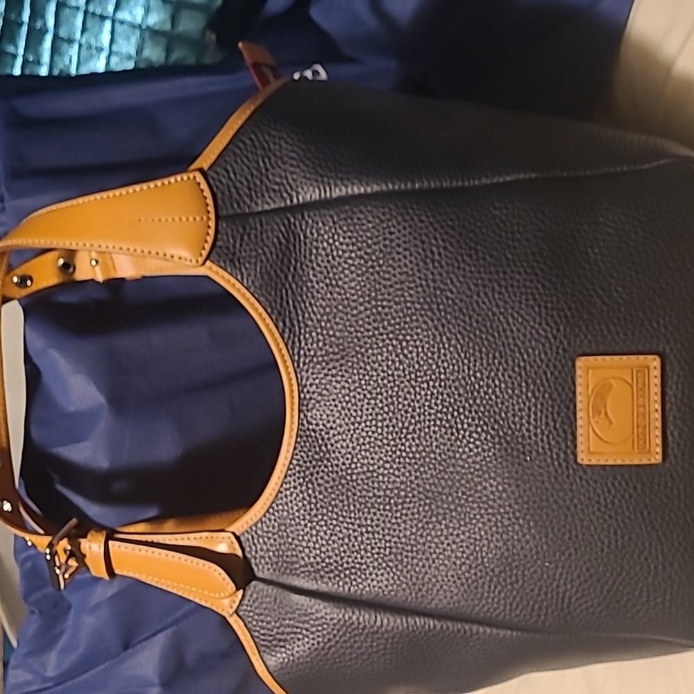 Dooney & Bourke pocket book new never used